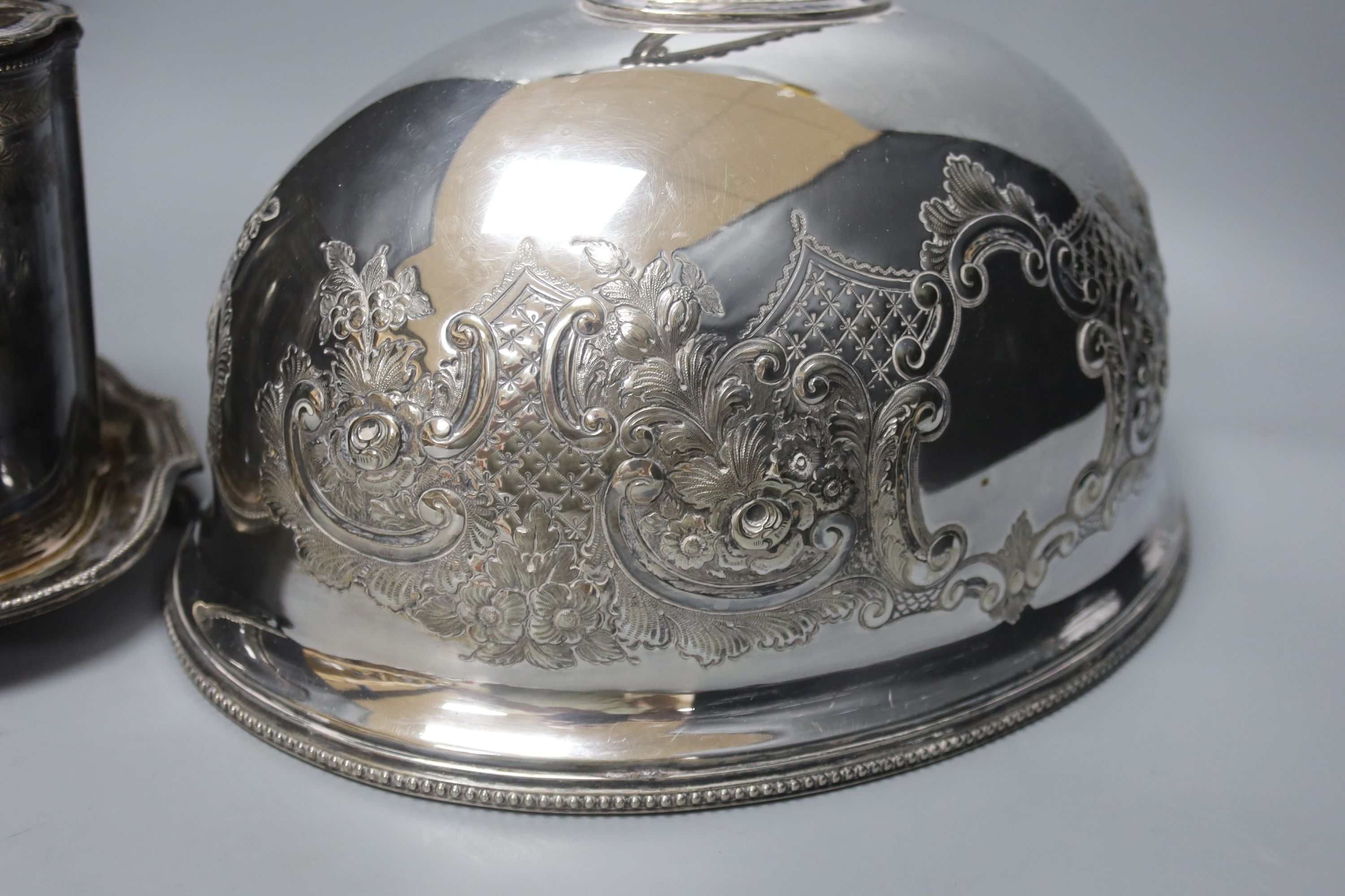 A French silver plated biscuit barrel and a meat dish cover